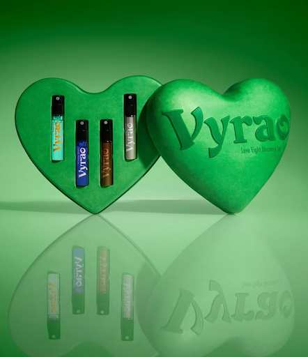 Green heart-shaped gift box featuring Vyrao wellness perfumes, representing mood-enhancing spiritual fragrance collection.